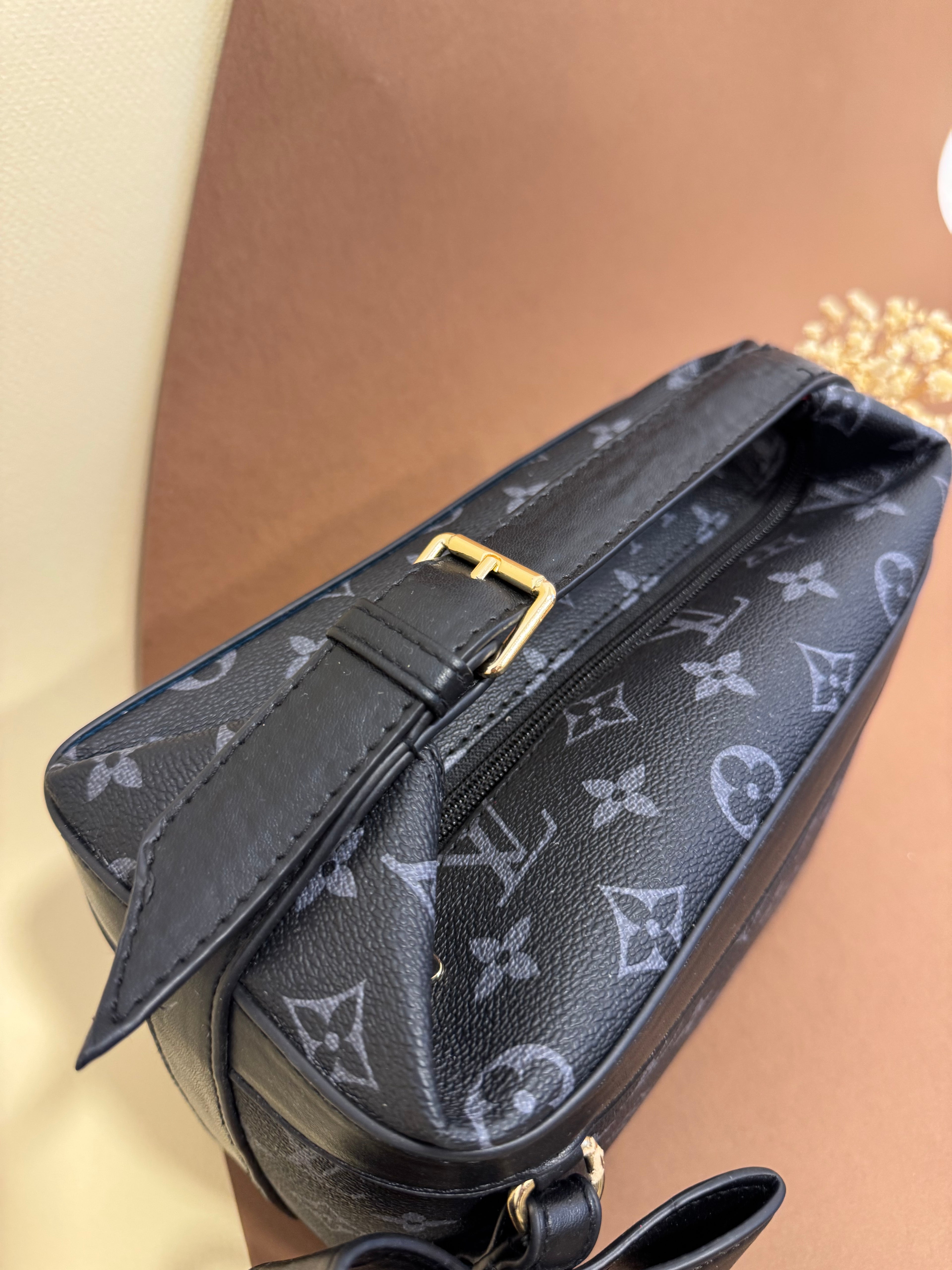 LV strap bag
